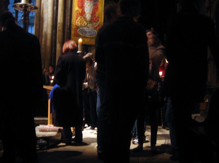  Visitors congregate silently at the Shrine of St Cuthbert. 